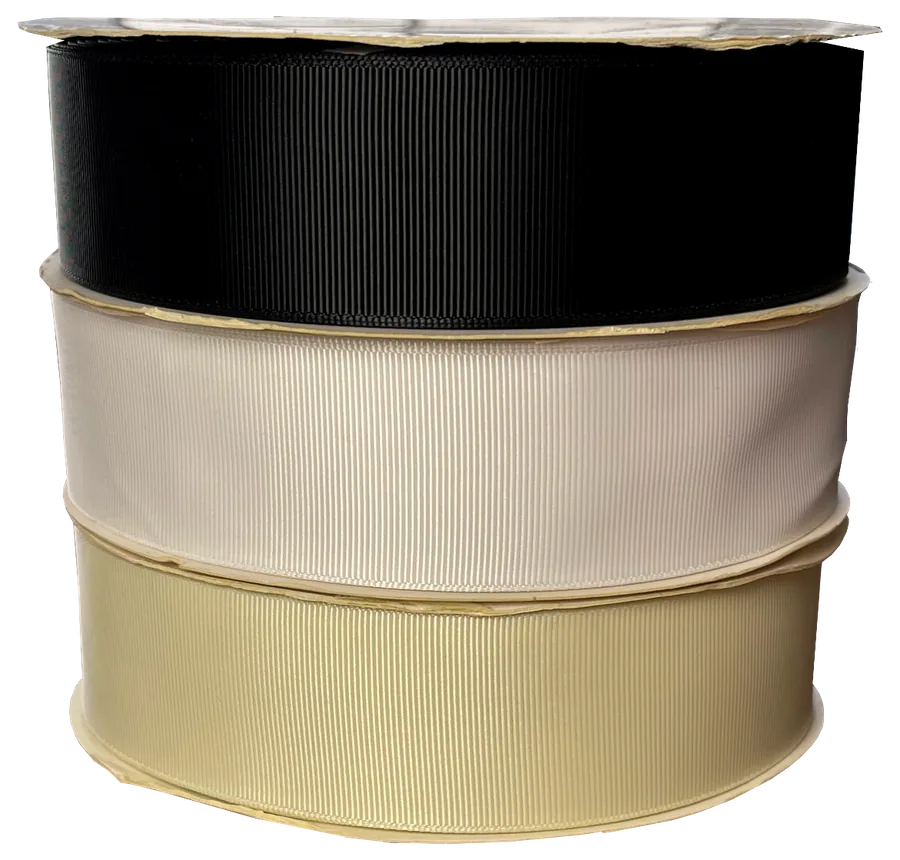 Rollos de cinta faya en negro, blanco y beige